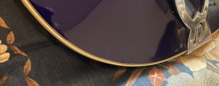the scratch is at approximate center of photo near the edge.